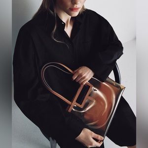 Clear purse with leather insert